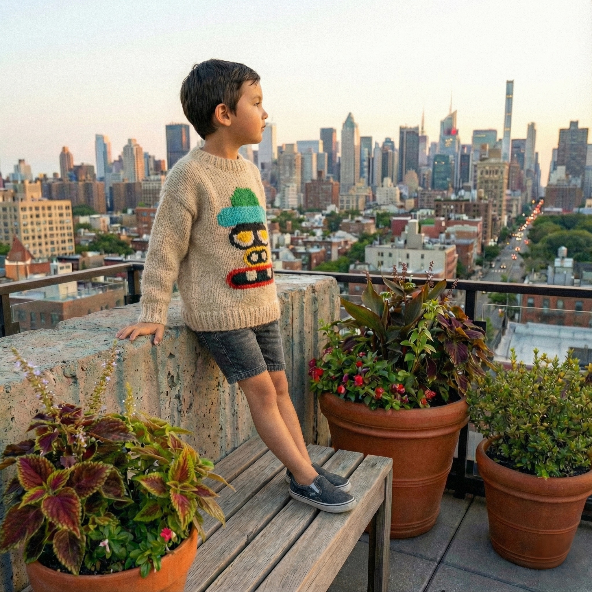 A knitted sweater featuring the colorful Nibbu face